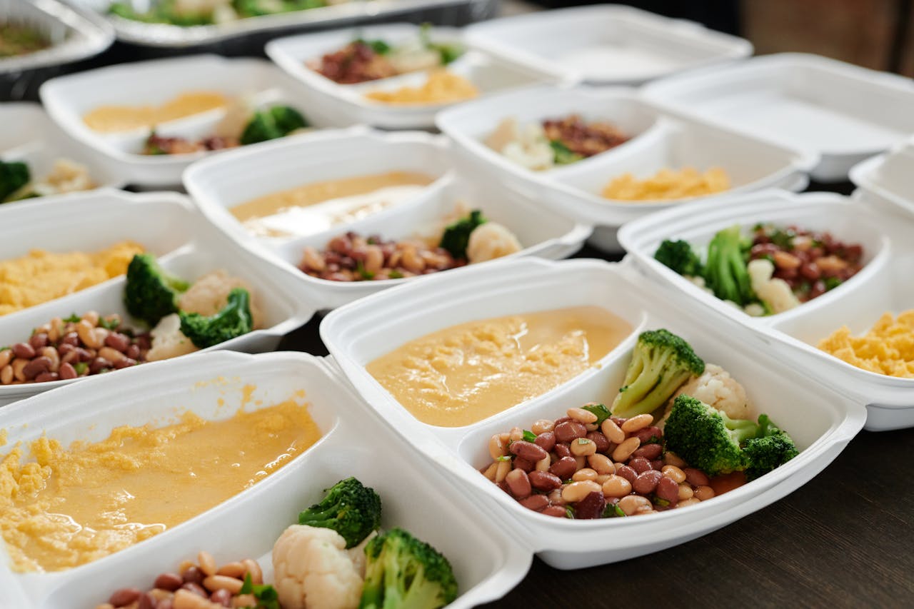 Services Delicious and nutritious meal prep featuring broccoli, beans, and eggs in containers.